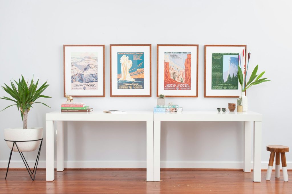 white wooden shelf with picture frames